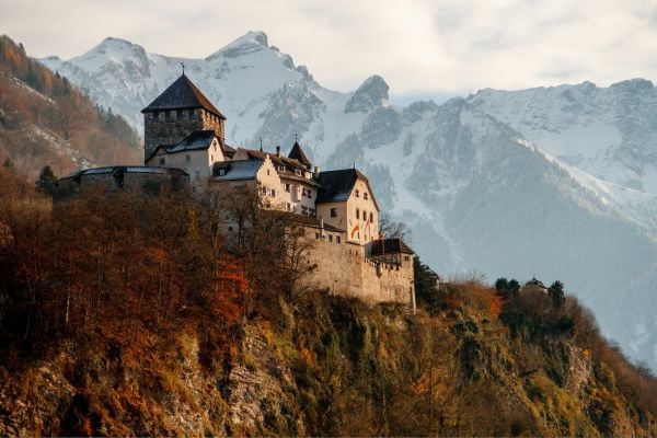 An old castle amongst snowy mountains in Liechtenstein
